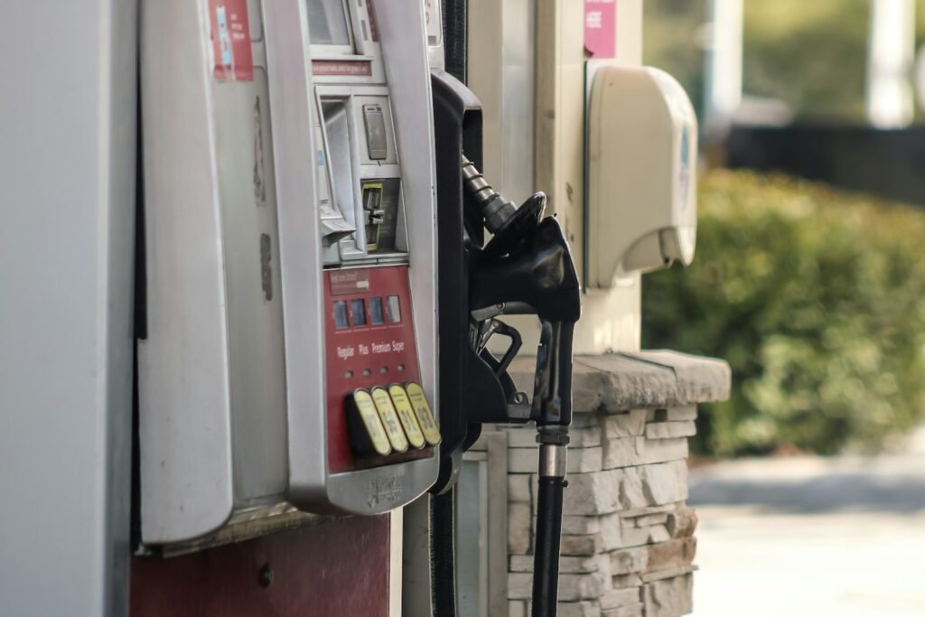 Gas pump beside a brick wall, illustrating gasoline's effect on headline inflation