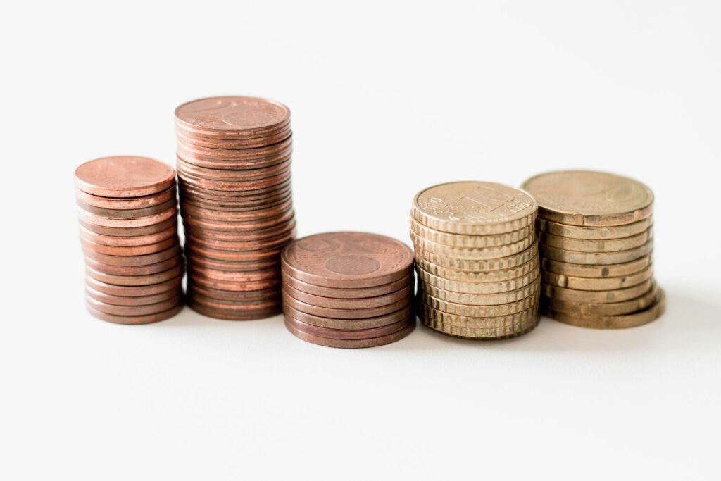 Stacked gold-colored coins representing cash returned to shareholders