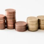 Stacked gold-colored coins representing cash returned to shareholders