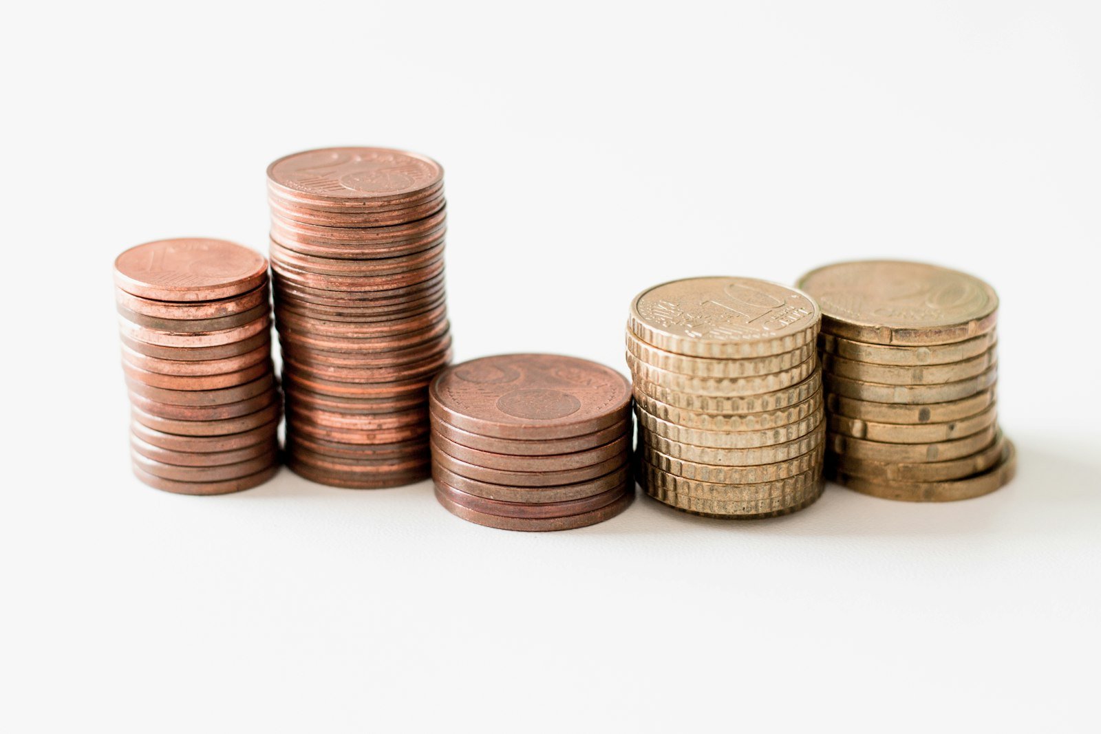 Stacked gold-colored coins representing cash returned to shareholders